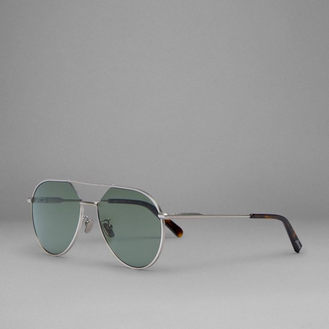 Gunmetal aviator sunglasses with green lenses
